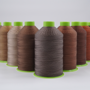 High-strength 207 Bonded Nylon Thread spools in various brown shades, ideal for leather sewing machines, perfect for stitching leather products like shoes, bags, and wallets.