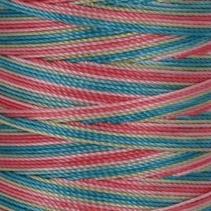 Close up of multicolored twisted yarn strands in pink blue and green