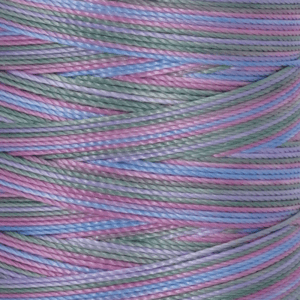 Close up of pastel colored twisted ropes in pink blue green and purple hues