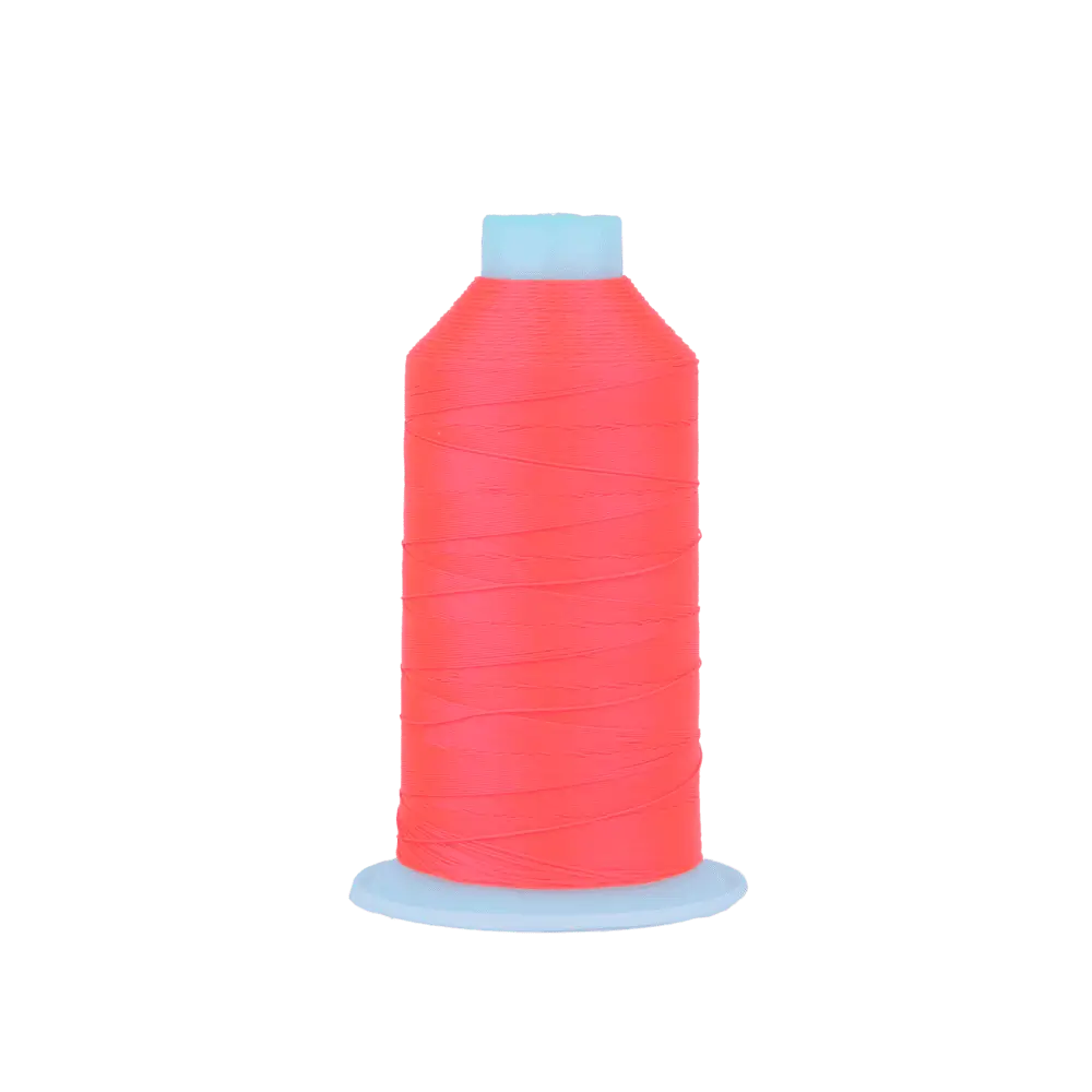 Close up of a neon pink thread spool with a light blue cap at the top and base