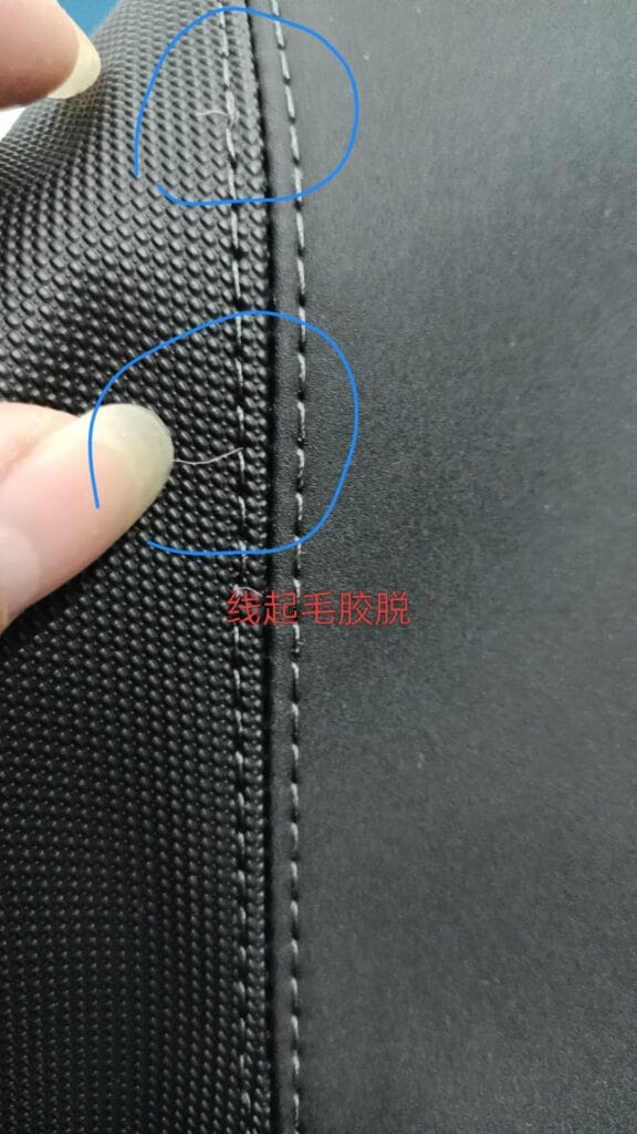 Marked close up of NEXUS Tex90 thread showing loose surface fibers during double needle sewing